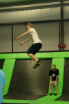Boy Jumping Very High at Trampoline Park